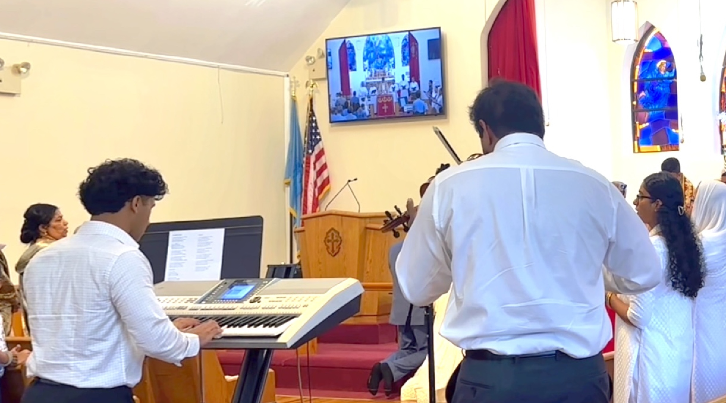 Joshua Samuel playing at a baptism service